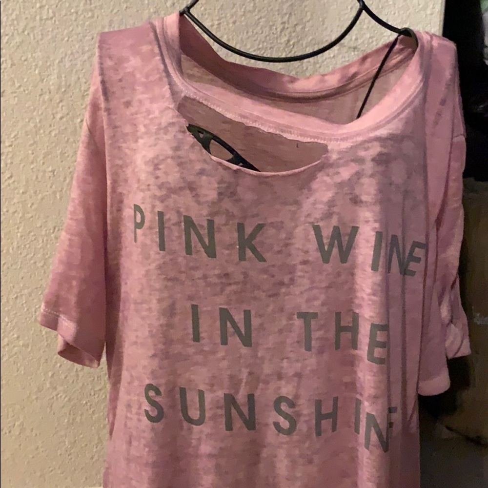 Pink wine in the sunshine shoulder out